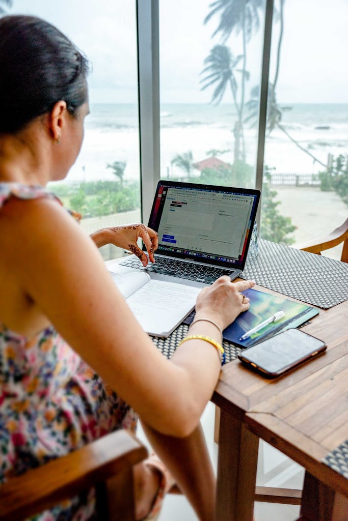 Photo of Woman Using a Laptop